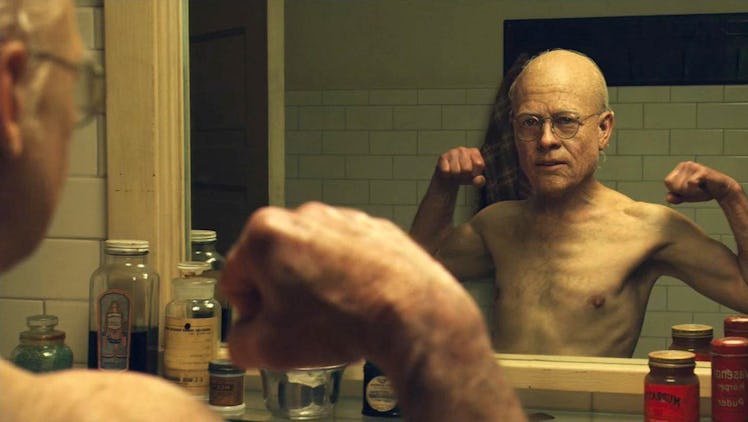 Benjamin Button looks in the mirror as an "old" child