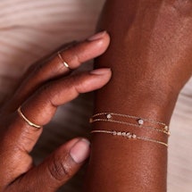 Hands wearing welded bracelets
