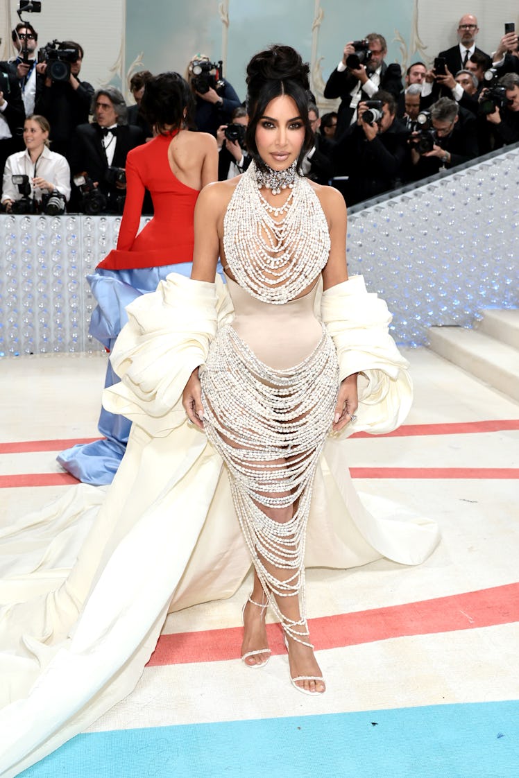 Kim Kardashian dripping in pearls at the 2023 Met Gala.