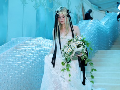Elle Fanning wearing a wedding dress at Met Gala 2023.