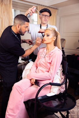 Paris getting glam wearing a pink tracksuit