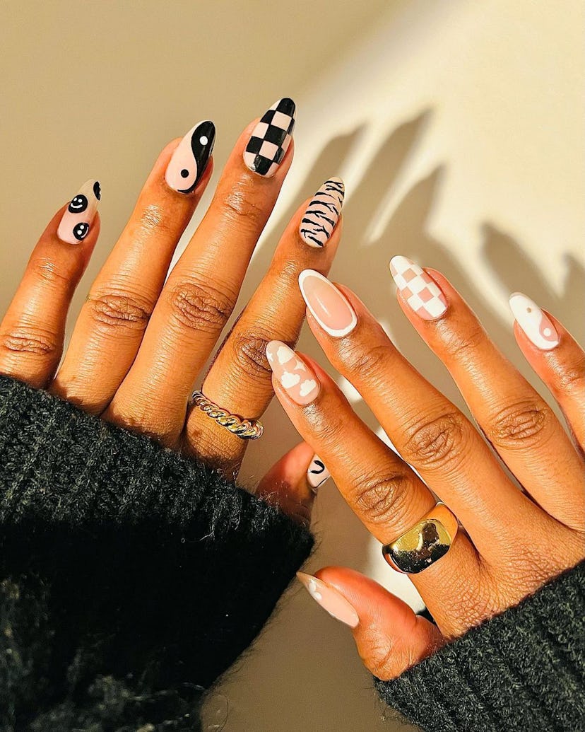'90s nails with yin yang signs & checkers are the perfect nail art design idea for a manicure during...