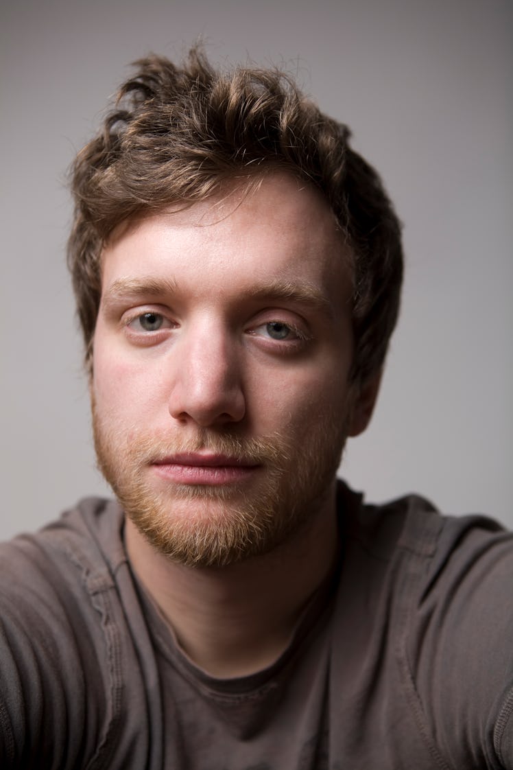 A man with dark circles under his eyes.