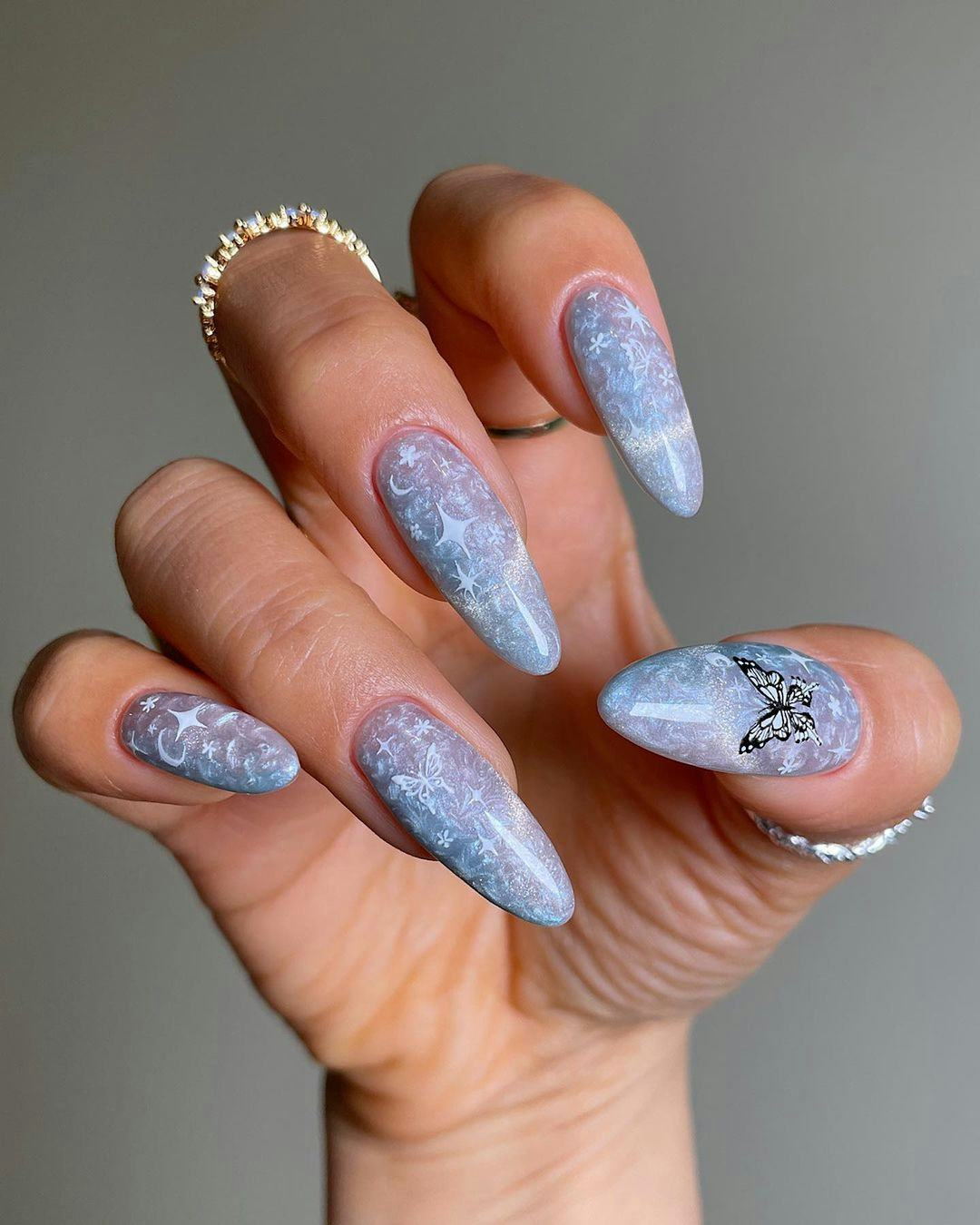 Butterfly nails are the perfect nail art design idea for gemini season 2023.