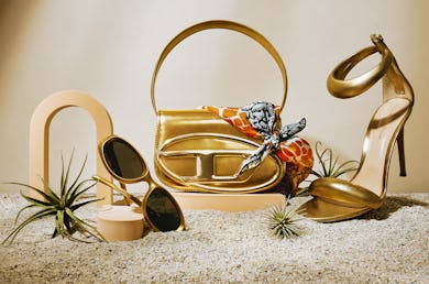 gold diesel 1DR bag, gold sandals, and gold sunglasses for summer 2023