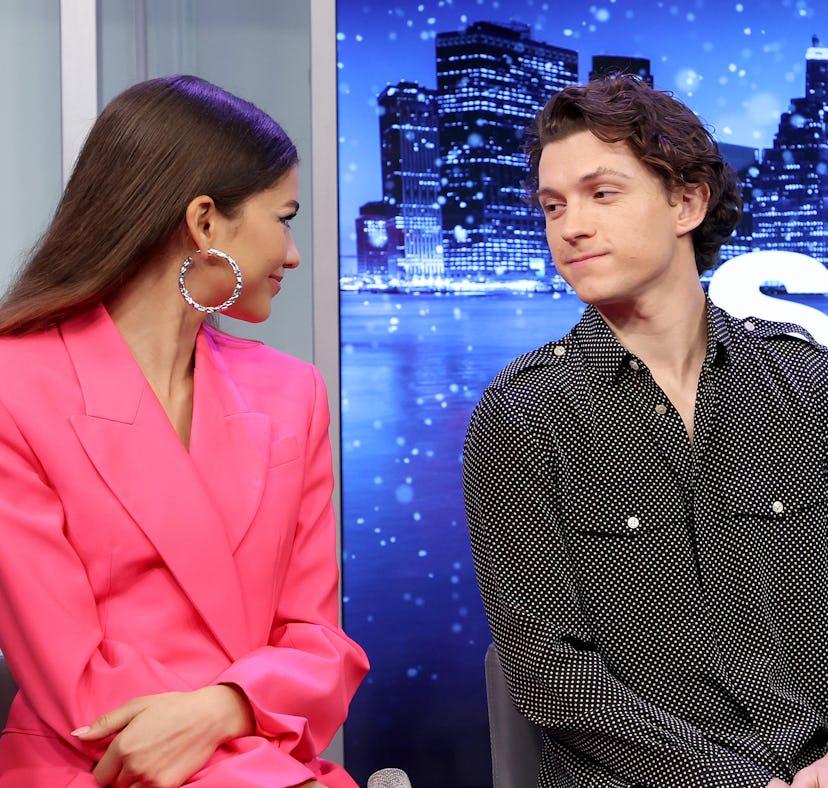 Tom Holland, a Gemini, looking at Zendaya with love in his eyes.
