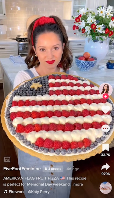 A woman makes an American flag fruit pizza for a Memorial Day recipe on TikTok. 