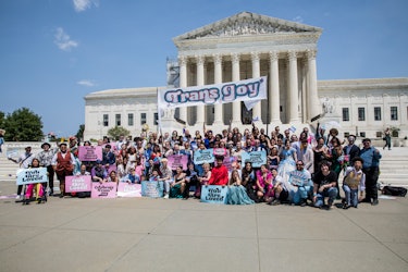 Attendees of the Trans Prom gather in front of the Supreme Court.