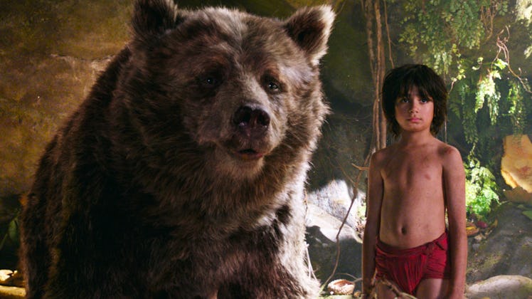 Baloo and Mowgli stand together in 2016's The Jungle Book