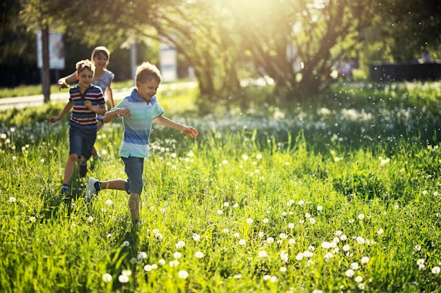 Kids play tag in the summer