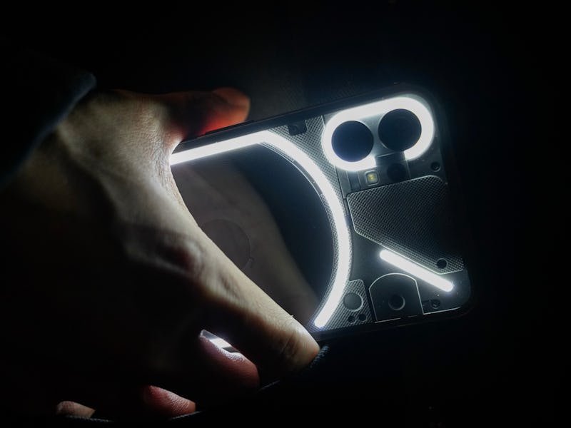 Nothing Phone 1 with Glyph LEDs turned on. Photo taken by Inverse editor Raymond Wong