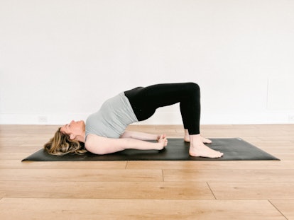 A bridge yoga pose will release tension in your shoulders post-flight.