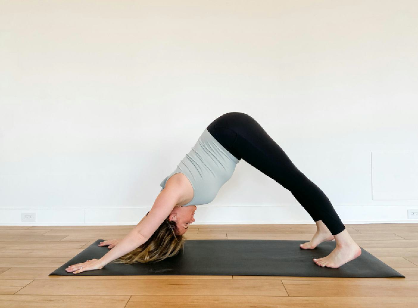 Downward dog will help loosen up tight hamstrings after a flight.