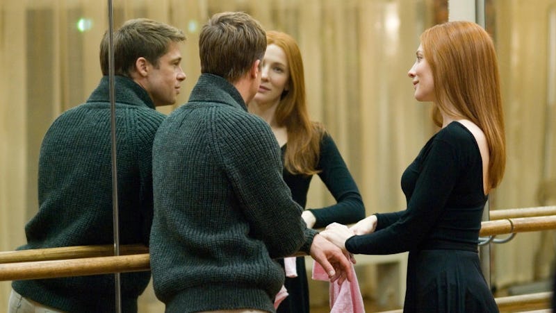 Brad Pitt and Cate Blanchett stand next to a mirrored wall in The Curious Case of Benjamin Button