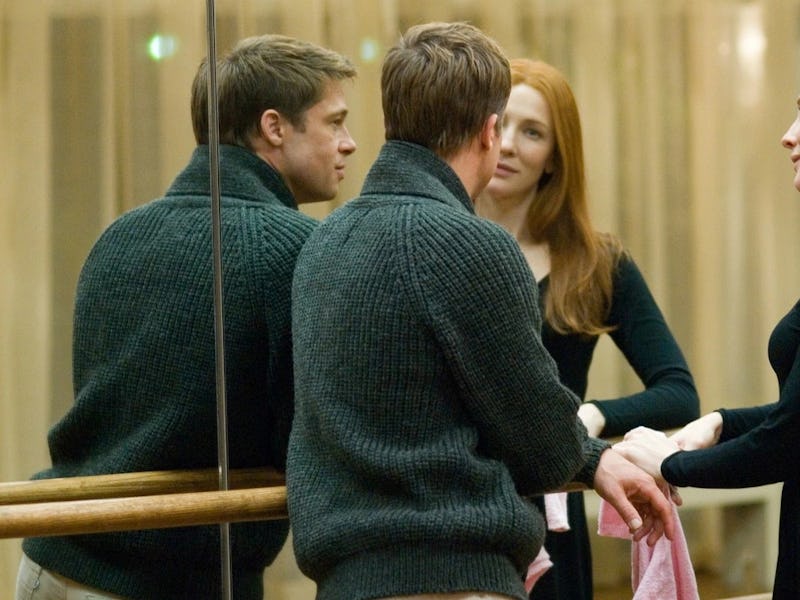 Brad Pitt and Cate Blanchett stand next to a mirrored wall in The Curious Case of Benjamin Button