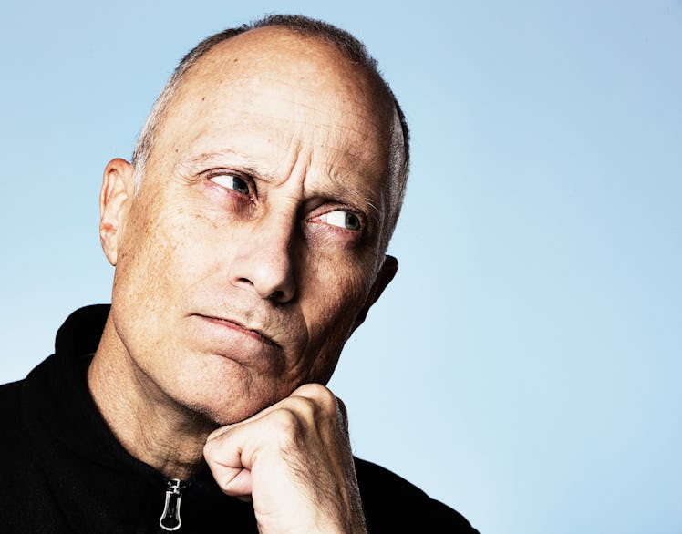 Grumpy man, middle-aged, glancing sideways