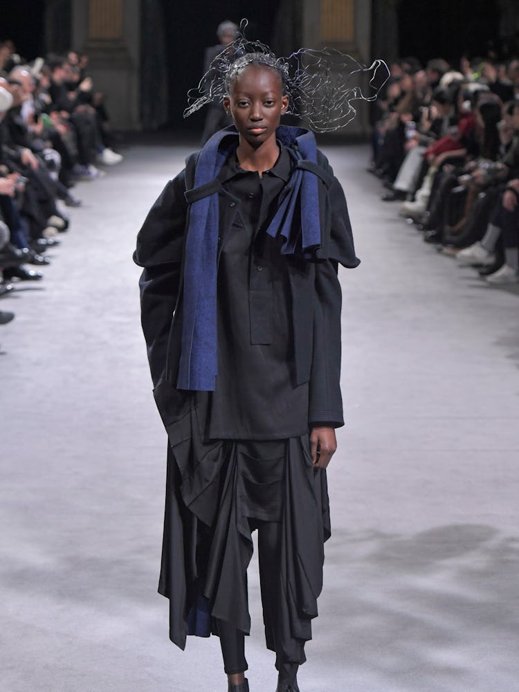 A model walks the runway during the Yohji Yamamoto Ready to Wear Fall/Winter 2023-2024 fashion show ...