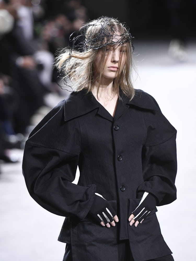 Model on the runway at Yohji Yamamoto Fall 2023 Ready To Wear Fashion Show on March 3, 2023 at Hotel...