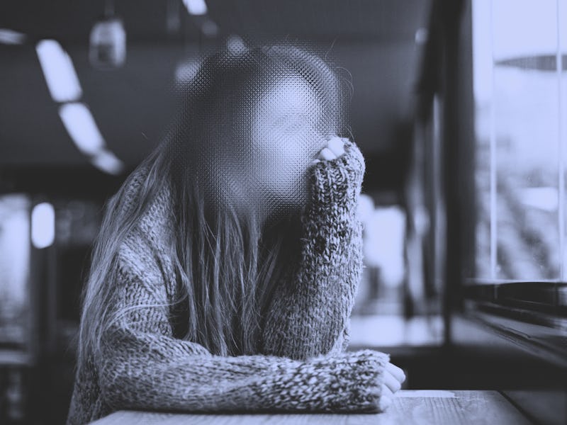 woman staring out window