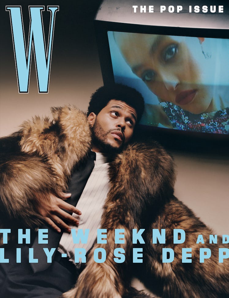 The Weeknd wears a black tie, brown fur coat, pin-stripe button-down shirt, and black pants.