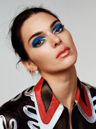 Kendall Jenner wears a colorful leather shirt.