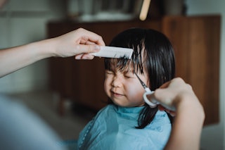 A child getting their first hair cut