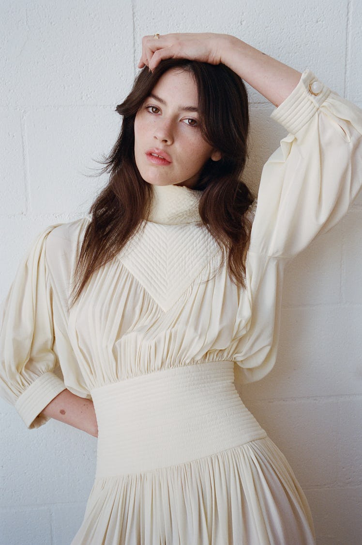 Gracie Abrams wears a Louis Vuitton dress; State Property ring.