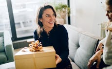 Woman opening expensive gift