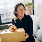 Woman opening expensive gift