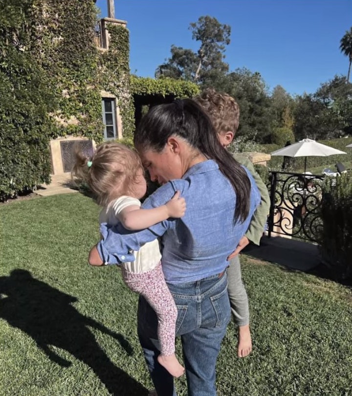 Meghan Markle holds Archie and Lilibet in her arms.