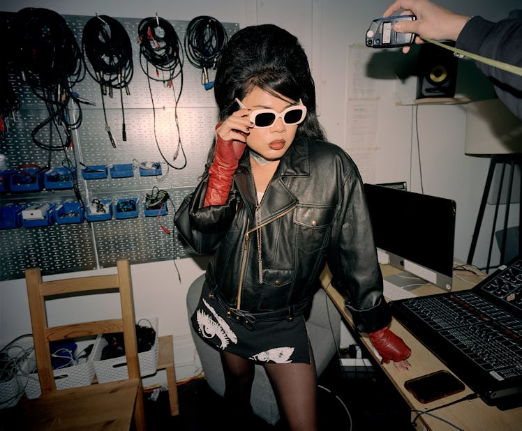 DeSe Escobar wears a Celine by Hedi Slimane jacket, tank top, sunglasses, and necklace; Ratio x Club...