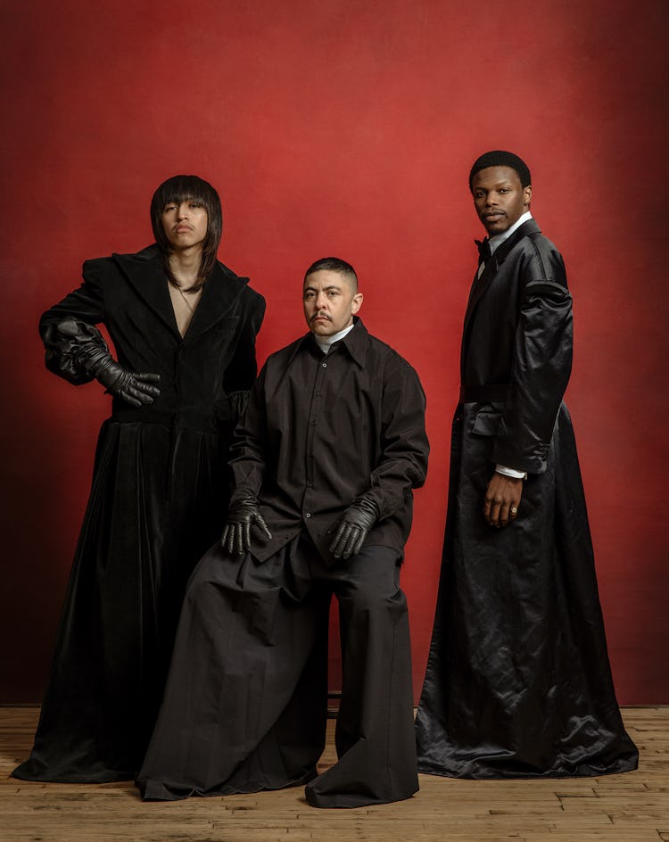Models Rico, Cuevas, and Taylor Wiles wears oversized black jackets, black shirt, black gloves, blac...
