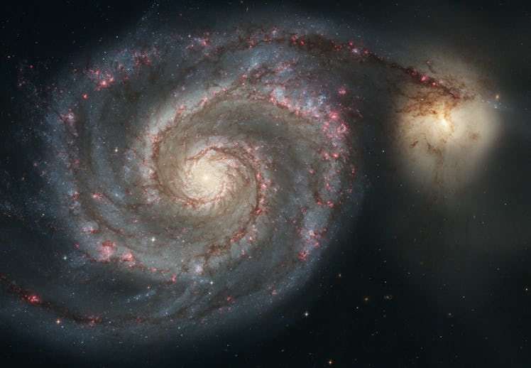 two galaxies side by side in an image captured by the hubble space telescope