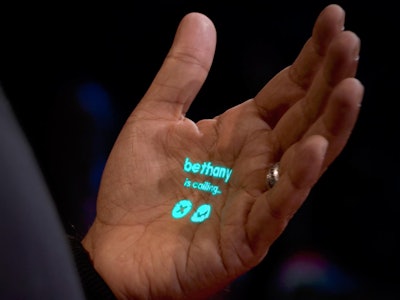 Humane Wearable AI Projector showing projection on Co-founder Imran Chaudhri's hand at TED 2023