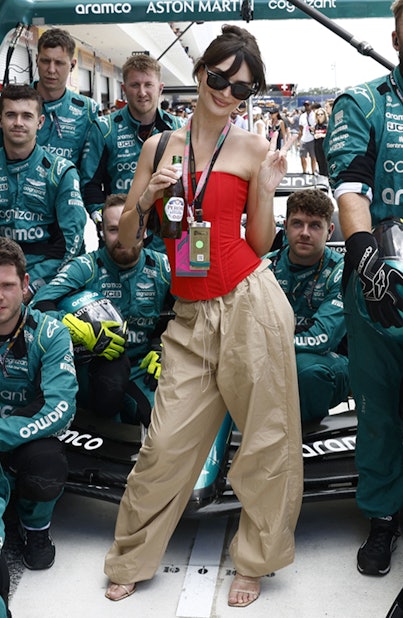 Emily Ratajkowski poses with the Aston Martin Aramco Cognizant Formula One Team on May 7 at the Miam...