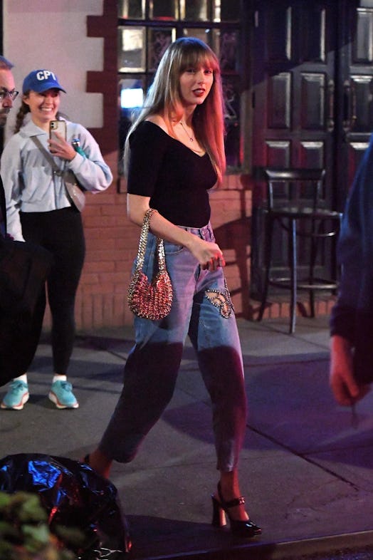 Taylor Swift wears Area jeans and a Paco Rabanne bag while in New York City.
