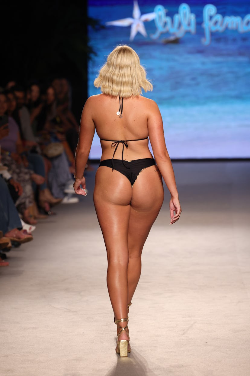 A model walks the runway for luli fama during Paraiso Miami Swim Week 2023 in a thong bikini