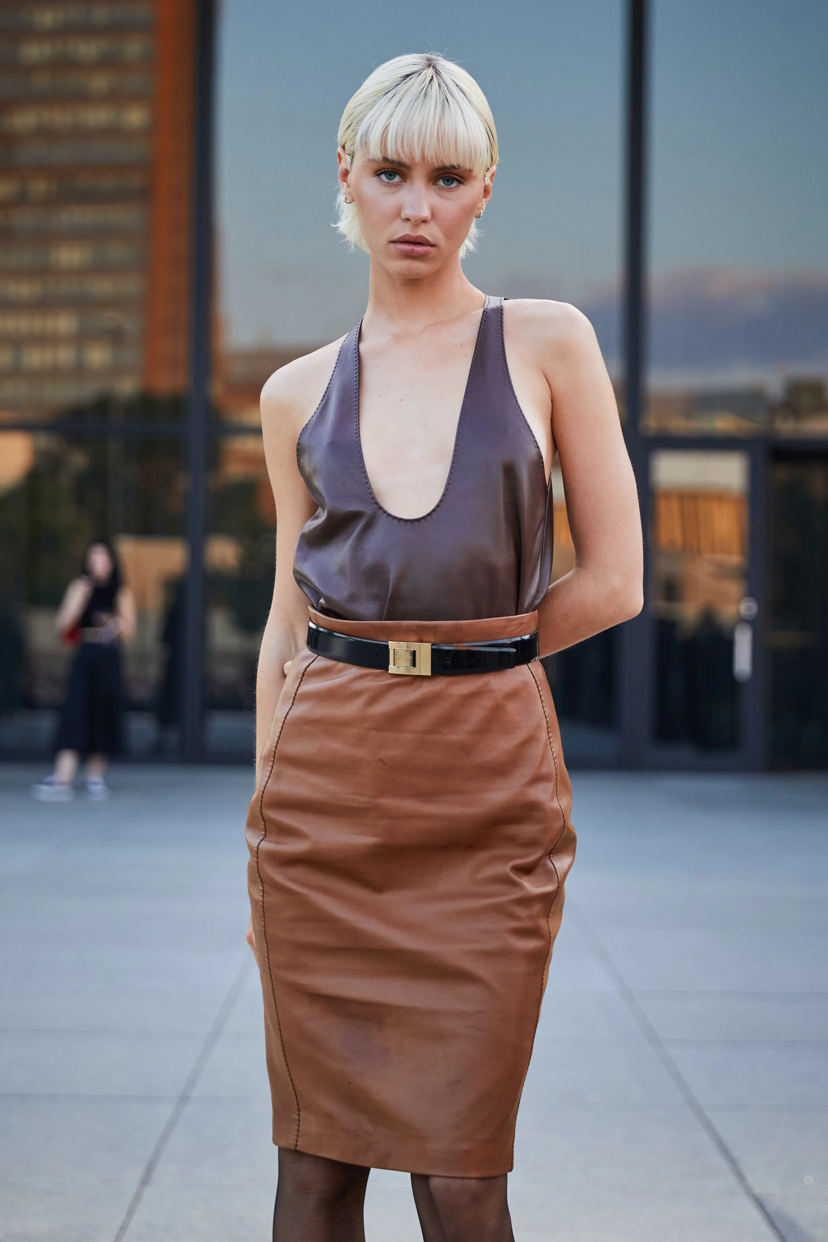 Iris Law Pairs a Low-Cut Leather Tank With Brown Pencil Skirt - Vimarsana News