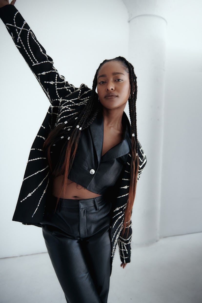 A portrait of Arsema Thomas wearing a leather jacket