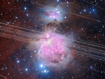 A long-exposure image of the Orion Nebula with a total exposure time of 208 minutes showing satellit...