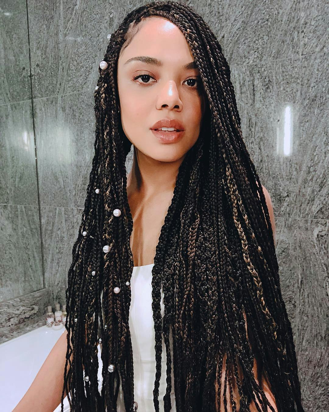 Young african american woman with braids wearing casual summer