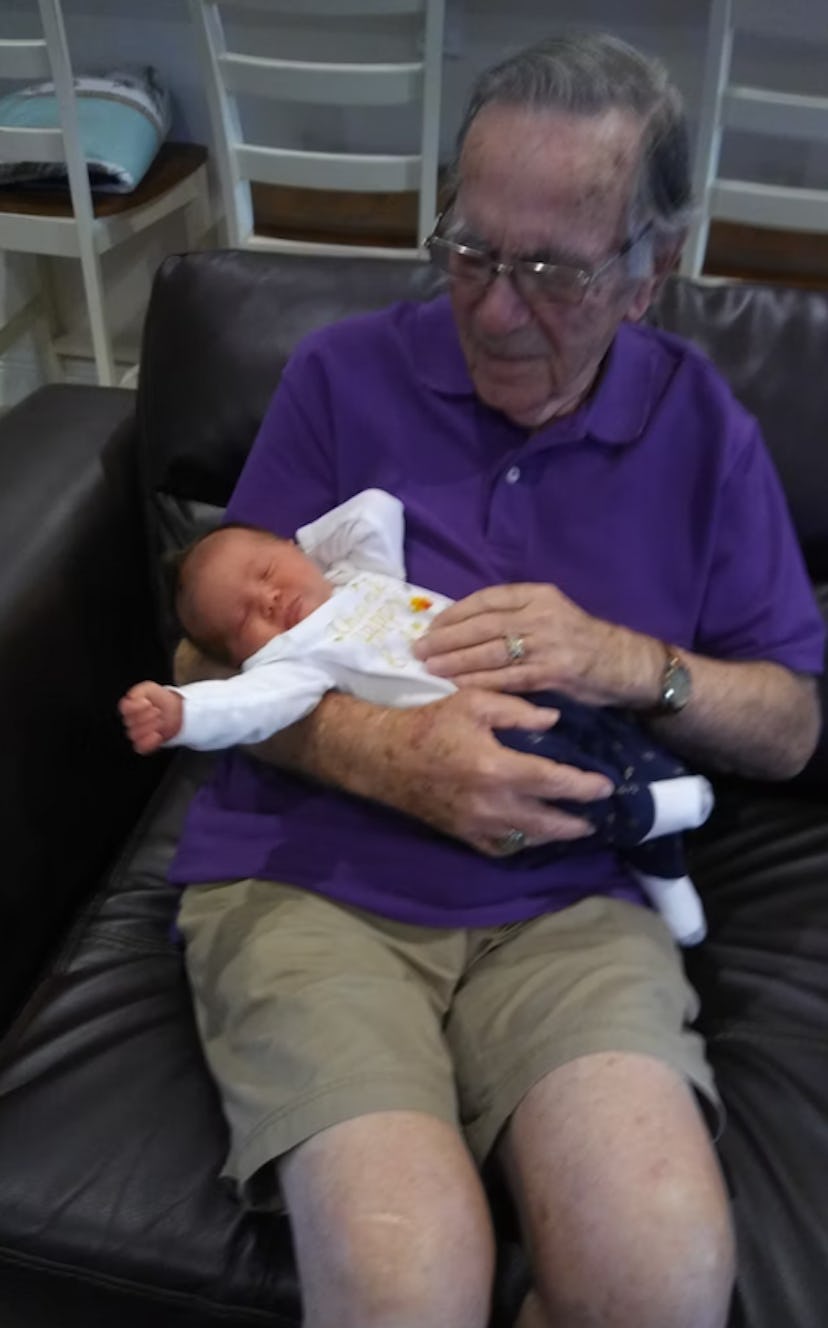 Photo of grandparent meeting his grandbaby for the first time