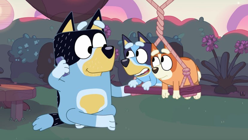 Bandit plays with Bluey and Bingo on a swing in "Daddy Putdown"