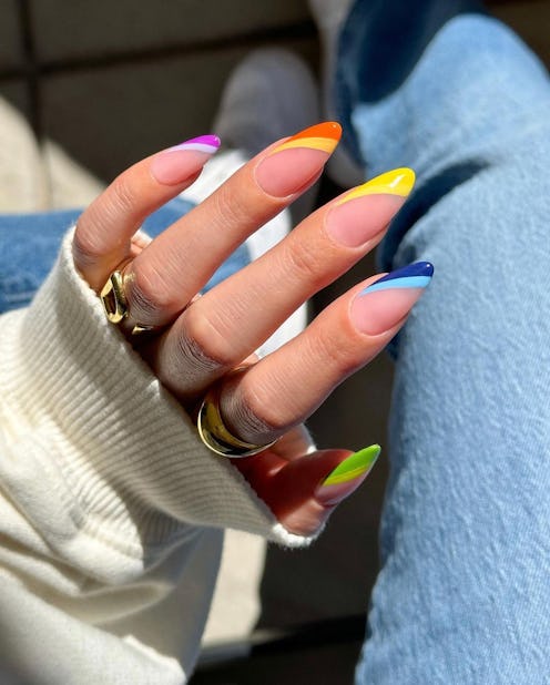Put rainbow French tips on your nails for the ultimate colorful Pride manicure.