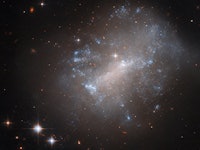 This is irregular galaxy NGC 7292, which lacks the standard broad arms of spiral or elliptical galax...