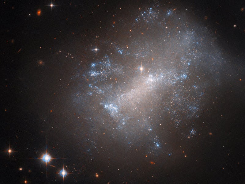 This is irregular galaxy NGC 7292, which lacks the standard broad arms of spiral or elliptical galax...