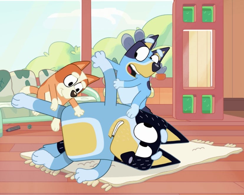 Bandit wrestling with Bingo and Bluey.