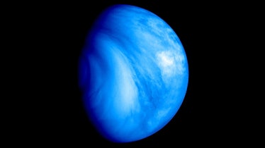 photo of a blue planet on a black backgroudn