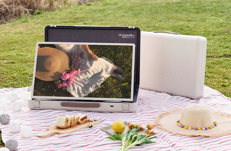 The LG StandbyME Go unfolded at a picnic.