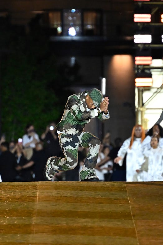 Louis Vuitton Men's Creative Director Pharrell Williams acknowledges the applause of the audience af...